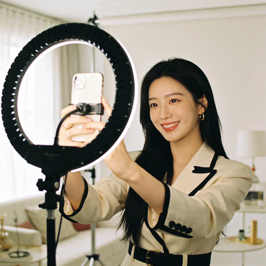 A solo content creator filming in her home studio