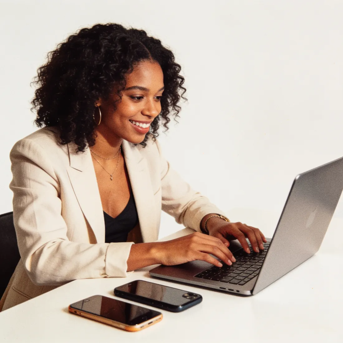 A creator producing a batch of posts at her laptop